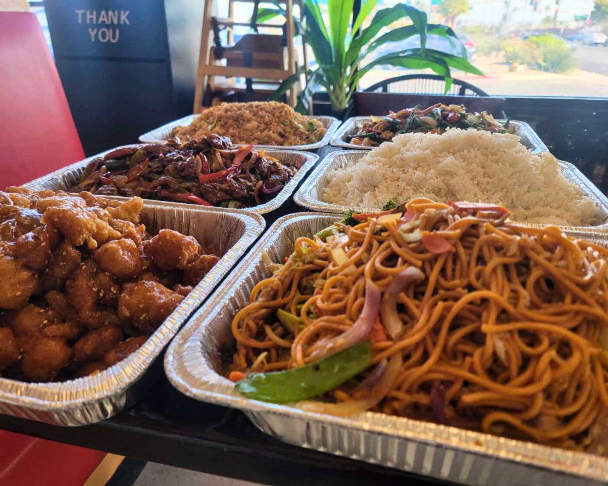 Assorted Chinese dishes in trays at Gourmet Wok Chinese Food, a Chinese restaurant in Las Vegas.